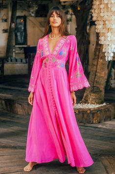 Cartagena Gown in bright magenta color is a romantic masterpiece on its own. So much detail has gone into creating this stunning design including an elegant empire waist and fabric covered button up silhouette, elasticated back to fit well all body shapes and embroidered cool bell sleeves. This gorgeous button-up can be worn also open as a layering piece adding an incredible depth to any outfit. Pair this beauty with tan slides and fine jewelry for an afternoon soiree with friends.100% Rayon SIZ Hemant And Nandita, Magenta Color, Long Linen Dress, Panel Dress, Fabric Covered Button, Kimono Dress, Linen Dresses, Fabric Covered, A Romantic