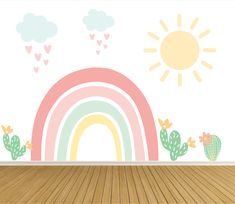 an empty room with a rainbow and cactus wall decals on the wall, in front of a wooden floor