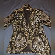 Beautiful Black Coat With Gold And Silver Embroidery. There Are Some Loose Threads In The Embroidery. False Pocket, Single Button. Size 4. It's Very Fitted And Flattering. Length: 27" Shoulder To Shoulder: 15" Pit To Pit: 17" Shoulder To Cuff: 23" Pit To Cuff:17.5" Formal Fitted Outerwear With Floral Embroidery, Embroidered Fitted Outerwear For Evening, Festive Embroidered Blazer For Workwear, Festive Embroidered Blazer For Work, Floral Embroidery Fitted Formal Outerwear, Elegant Fall Outerwear With Gold Embroidery, Festive Fitted Outerwear With Floral Embroidery, Embroidered Fitted Outerwear For Party, Formal Embroidered Fitted Outerwear