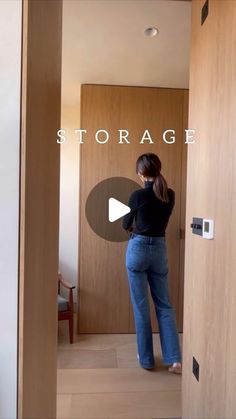 a woman standing in an open doorway with her back to the camera and text storage