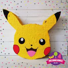 a close up of a paper mache of a pikachu