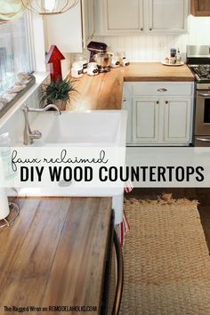 a kitchen with white cabinets and wood counter tops