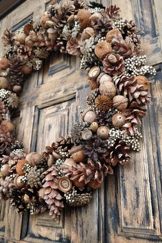 a wreath made out of pine cones and nuts