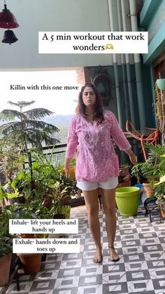 a woman standing in front of potted plants on a tiled floor next to a building