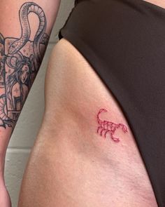 a woman with a tattoo on her thigh