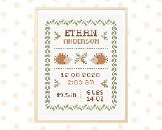 a cross stitch pattern with the birth date on it and an image of two hedges