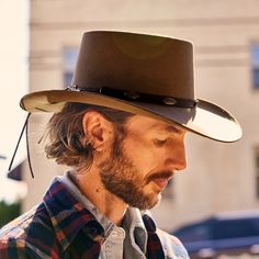 This western-inspired fashion hat brings a welcome pop of Cowboy Core to any look. Its bold silhouette features a statement-making 3 1/2" telescope crown, 3 1/2” downturn brim and leather hat band with silver-tone conchos. Handmade in the U.S.A. with a firm finish from high-quality wool felt, it’s finished with a faux leather sweatband and satin liner for a comfortable, all-day fit. 3 1/2" Telescope Crown 3 1/2" Downturn Brim Leather Hat Band With Silver-Tone Conchos Faux Leather Sweatband Satin Cowboy Core, Wild Bunch, Straw Cowboy Hat, Leather Hat, Cut Tees, Denim Boots, Western Hats, Leather Hats, Wool Handmade