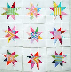 the star quilts are all different colors and sizes