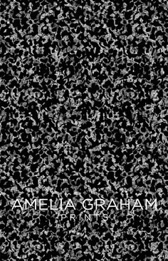 black and white photograph with the words amelia graham on it's left side, surrounded by small speckles