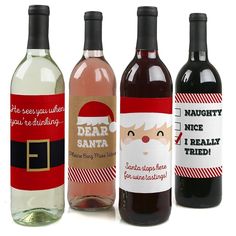 three bottles of wine with santa's face on the label, one is red and one is white