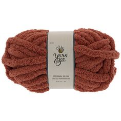 yarn ball in brown color on white background