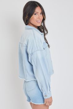 Add some edgy layers to your go-to outfits this season with our Women's Cropped Denim Jacket With Raw Hem. Complete with all standard trademarks: buttoned flap pockets, button-cuff long sleeves, exposed front button closure, basic collar, and a cropped fit with raw hem. Measurement (Based on size M) - Sleeve Length (From shoulder seam): 18” - Length: 21” - Chest: 22.5” Composition: - 81% Cotton/ 10% Polyester/ 9% Rayon • Machine wash cold. • Model is wearing a size S. Spring Light Wash Denim Jacket With Buttoned Pockets, Trendy Collared Light Wash Denim Jacket, Spring Washed Blue Denim Jacket With Buttoned Pockets, Light Wash Denim Jacket With Buttoned Pockets For Fall, Spring Denim Jacket With Frayed Hem, Spring Medium Wash Denim Top With Buttoned Pockets, Spring Denim Top With Buttoned Pockets In Medium Wash, Relaxed Fit Medium Wash Outerwear With Button Cuffs, Relaxed Fit Outerwear With Button Cuffs In Medium Wash