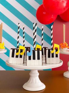 a cake with black and white piano keys on it sitting on top of a table