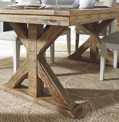 a wooden table sitting on top of a carpeted floor