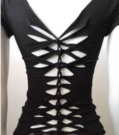 the back of a woman's black top with cut outs