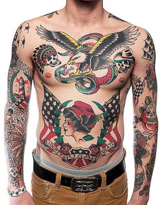 a man with many tattoos on his chest and arms is standing in front of the camera