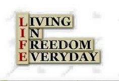 the words living in freedom every day are spelled by crosswords on white paper