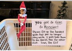 an elf is sitting in a basket with a sign on it that says, you got to give to receive please fill up the basket with toys