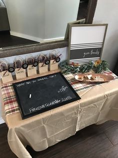 there is a table that has been set up with place cards and other items on it