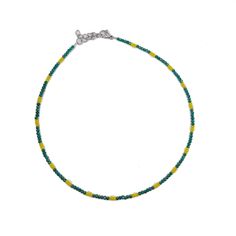 Beautiful shiny choker necklace with green and yellow crystal beads. This beautiful necklace made from 1mm green and yellow crystal beads, and closes with a stainless steel clasp and a stainless steel adjustable chain (2inches). SIZE This necklace is available in 2 different sizes: (14inch-16inch) - (6inch-18inch). Please contact with me if you prefer a different size. Every item we sell is handmade and handcrafted with love and care. All PolysJewelryArt jewelry arrived in a beautiful box or pouch ready for giving. We advise you to try to keep the jewelry away from water, chemicals and perfumes to keep it in perfect contition. Feel free to contact me for any questions or requests. Cancellations - We accept cancellations within 12 hours of purchase. Contact with me for any question. Adjustable Green Choker With Tiny Beads, Green Beaded Choker Jewelry, Green Tiny Beads Choker, Green Choker With Tiny Round Beads, Green Tiny Beads Choker Necklace, Adjustable Yellow Choker With Tiny Beads, Yellow Tiny Beads Choker For Gift, Yellow Tiny Beads Choker As Gift, Green Beaded Choker