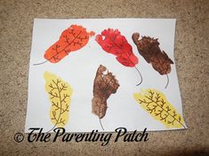 an art project with leaves and acorns painted on white paper that says the parenting patch