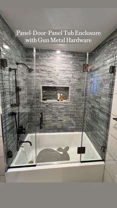 a white bath tub sitting inside of a bathroom next to a shower head and window