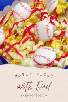 a bowl filled with popcorn covered in red and white baseballs next to the words movie night with dad