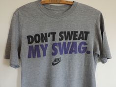 Vintage Tee Shirt. Nike Athletic Wear 100% Cotton T. Shirt featuring Nike Don't Sweat My Swag! Gray T Shirt featuring Black and Purple Lettering Nike Logo... DON'T SWEAT MY SWAG! Size S One T shirt Please visit my Shop for Trendy Vintage Goods!  https://www.etsy.com/shop/SevenSeven52Vintage Thank you so much!! Swag Nike, Swag Shirts, Purple Tee, Vintage Tee Shirts, Shirt Nike, Nike Tshirt, Vintage Tee, Athletic Wear, Gray Tshirt