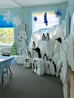 a room decorated with penguins and snowflakes