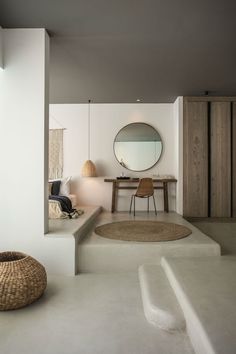 a bathroom with a sink, mirror and bathtub next to a staircase leading up to a bedroom