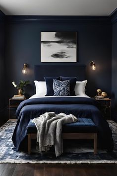 a bedroom with dark blue walls and white bedding