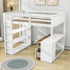 a white loft bed with stairs and desk in the corner, next to a rug