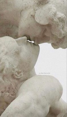 an image of a statue kissing someone's face