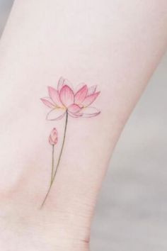 a small pink flower on the ankle with watercolors and ink in it's petals