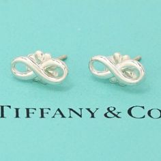 I Ship Within 1 Business Day Authentic Includes Tiffany Box And Pouch Description & Details Tiffany Infinity Is A Powerful Symbol Of Continuous Connection, Energy And Vitality. The Sleek Lines Of These Sterling Silver Earrings Catch The Light To Create Added Dimension. Sterling Silver Mini Product Number:60013 Silver Infinity Earrings For Formal Events, Silver Infinity Earrings For Formal Occasions, Elegant Sterling Silver Infinity Earrings, Elegant Silver Infinity Shaped Earrings, Elegant Silver Infinity Earrings, Tiffany Box, Stud Earrings Silver, Mini Studs, Tiffany Jewelry