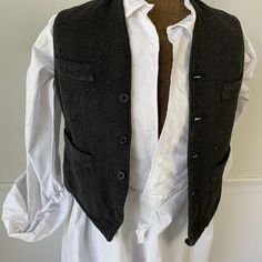 Welcome to The Textile Trunk ~ Please follow us on instagram! We are textiletrunk This handsome vest is French and dates from the very early 1900's ~ This is a teen's size, smaller than most ( or a small man ) This vest uses a wool, tweed fabric for the front a woven grey twill tweed~ It's really wonderful! ~ and it's backed in a satin cotton, black fabric. The inside lining is a striped cotton and a plain gray cotton ~ A very dapper vest! ~ ( vest E 624) MEASUREMENTS : This textile measures app Lace Apron, French Gray, Tweed Waistcoat, Tweed Vest, Men's Waistcoat, French Workwear, Embroidered Bodice, Vest Waistcoat, Wool Vest