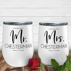 two white wine glasses with the names mr and mrs on them next to a rose