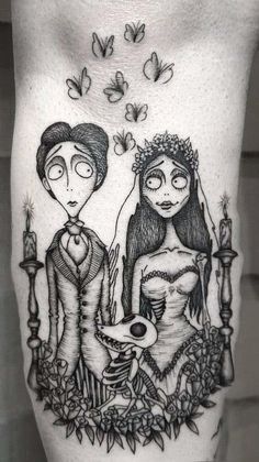 a woman and man tattoo on the thigh