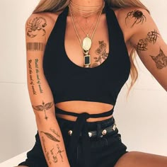 a woman with many tattoos on her arms