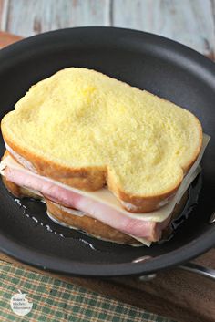 a ham and cheese sandwich in a skillet