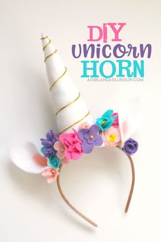 a white unicorn headband with flowers on it and the words diy unicorn horn above it