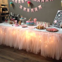 a table topped with lots of cake and desserts