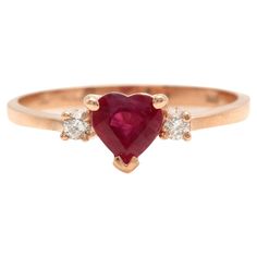 Impressive Natural Red Ruby and Diamond 14K Solid Rose Gold Heart Ring Suggested Replacement Value $2,500.00 Total Natural Red Ruby Weight is: Approx. 0.70 Carats Natural Round Diamonds Weight: Approx. 0.08 Carats (color G-H / Clarity SI) Ring size: 6.75 (free re-sizing available) Ring total weight: Approx. 1.8 grams Disclaimer: all weights, measurements and colors are approximate and may vary slightly from the listed dimensions or as seen in the image. All pictures are magnified to show the smallest of details. Please, refer to the item description for actual weight and size evaluation. SKU #1768 Rose Gold Heart Ring, Gift Wishlist, Gold Heart Ring, Rose Gold Heart, Rings Diamond, Ruby Rose, Ruby Diamond, Red Ruby, Gold Heart