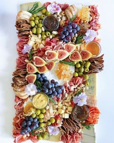 a platter filled with lots of different types of fruits and veggies on top of each other