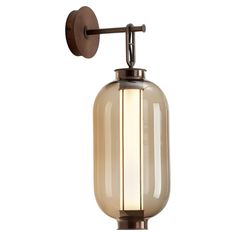 a wall mounted light with a glass shade