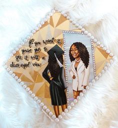 an ornament with a picture of a woman wearing a graduation cap and gown