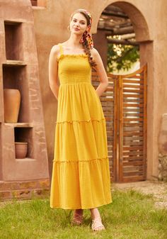 Embrace the warmth of the sun in this mustard yellow tiered maxi dress, another gem from our ModCloth namesake label. Sleeveless and serene, this dress cascades effortlessly down in beautiful tiers, creating a dance of light and fabric with every move you make. Ideal for balmy day ventures or serene evening soirees, its vibrant color brings a cheerful aura wherever it goes. Its airy, breathable fabric ensures endless comfort, making it a perfect companion for leisurely walks or sophisticated gatherings under the open sky. 100% Cotton Machine wash cold, line dry Imported Model 1 is wearing a US size S Model Measurements: Height 5'7"/ Bust 33''/ Waist 24''/ Hips 35'' | ModCloth Glimmering Goddess Maxi Dress in Gold Nugget Yellow Sun Dress Aesthetic, Yellow Tiered Maxi Dress For Summer, Yellow Tiered Maxi Dress For Vacation, Yellow Tiered Skirt Maxi Dress, Casual Yellow Tiered Maxi Dress, Goddess Maxi Dress, Open Sky, Yellow Sun, Gold Nugget