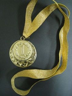 a gold medal with a ribbon around it