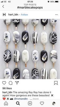 some kind of cake pops with black and white designs on them