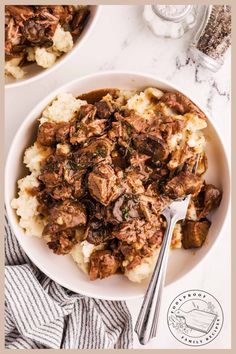 two bowls filled with meat and mashed potatoes on top of a marble countertop